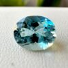 Loose Unheated Sea Blue Aquamarine Held in Tweezers