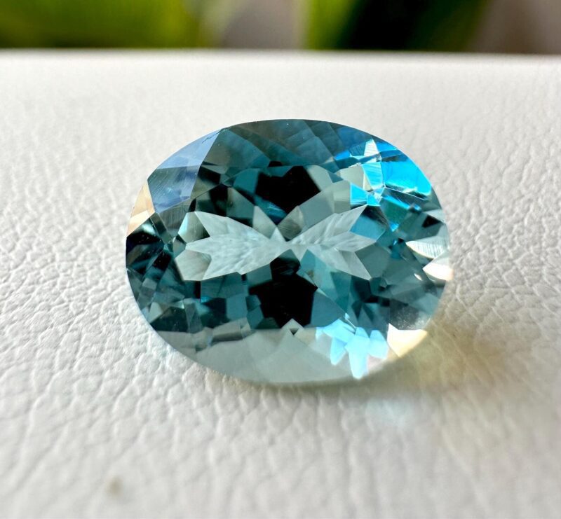 Loose Unheated Sea Blue Aquamarine Held in Tweezers