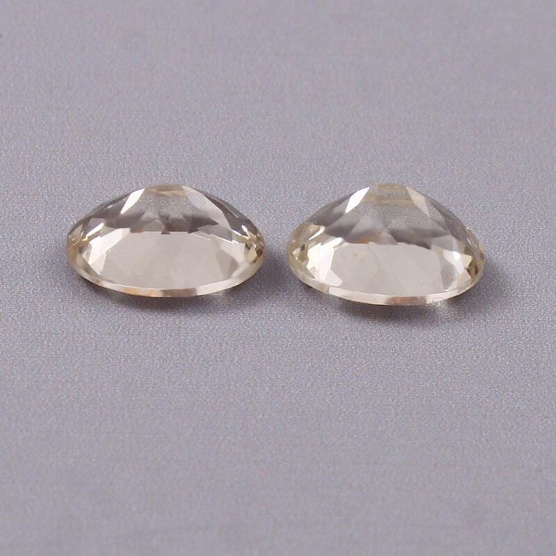 Loose Unheated Yellow Aquamarine Held in Tweezers for Custom Ring