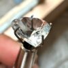 Angled View of Faceted Heart Cut Colorless Aquamarine Gemstone
