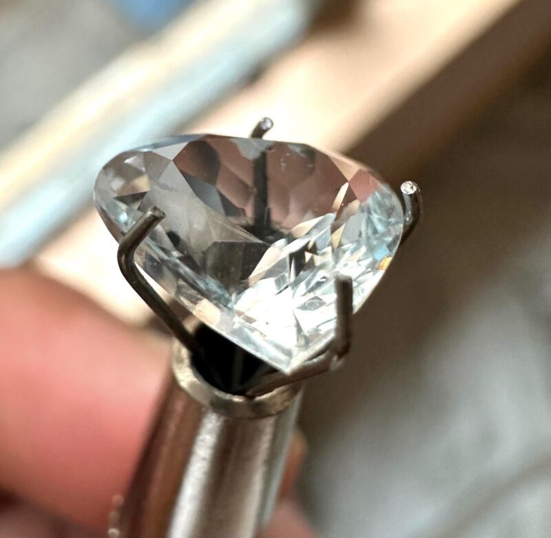 Angled View of Faceted Heart Cut Colorless Aquamarine Gemstone