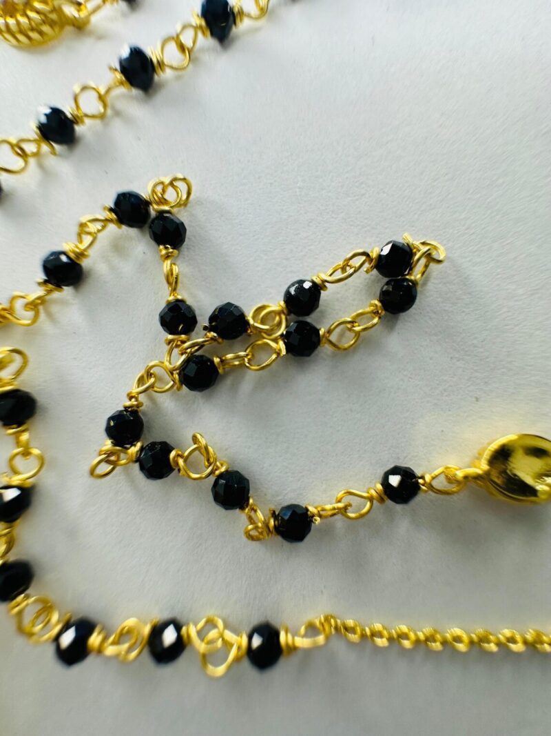 Beautiful Indian Woman Wearing Modern 18k Gold Mangalsutra Necklace