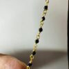 Macro Detail of 18k Gold Filigree Beads and Moissanite Diamonds