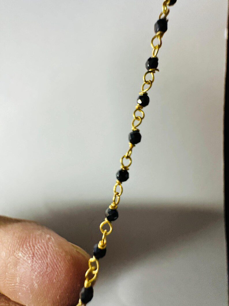 Macro Detail of 18k Gold Filigree Beads and Moissanite Diamonds
