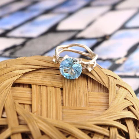 Woman Wearing Blue Topaz Silver Ring on Finger