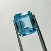 Natural Sky Topaz 8.25 Carat | 12x10mm Octagon Cut | Rare Sky-Blue Gemstone for Fine Jewelry Loose Sky Topaz Gemstone Held in Tweezers for Custom Jewelry