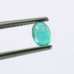 0.60 Carat Emerald Cabochon Size Reference 6.2x4.5mm on Hand