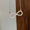 Infinity Moissanite Pendant Necklace | Rose Gold & Silver Minimalist Infinity Moissanite Pendant Necklace Front View Minimalist Design