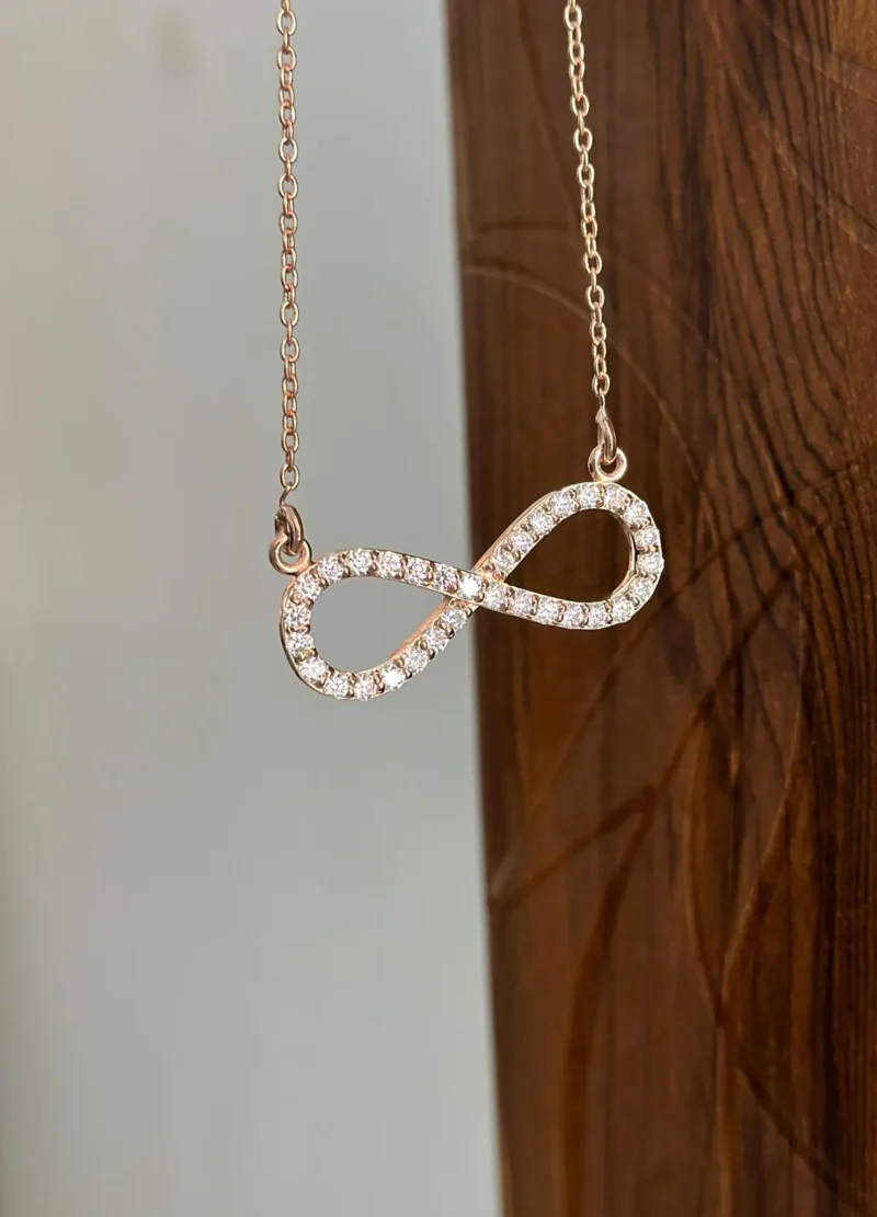 Infinity Moissanite Pendant Necklace | Rose Gold & Silver Minimalist Infinity Moissanite Pendant Necklace Front View Minimalist Design